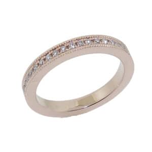 14K rose gold band pave set with 17 = 0.133cttw G/H, SI1-2 round brilliant cut diamonds.