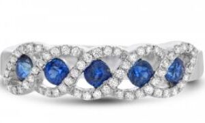 14 karat white gold band set with 60 = 0.19cttw round brilliant cut diamonds and 5 = 0.40cttw of sapphires.