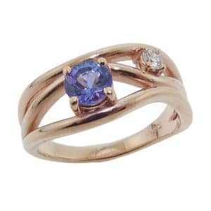 Lady's 10K rose gold ring set with 0.507 carat Tanzanite and 0.077 carat H SI1-2 round brilliant cut diamond.