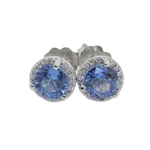 14K White halo stud earrings set with 2 round blue sapphires, 1.79cttw, and 0.10cttw diamonds, H/I, SI2-I1.