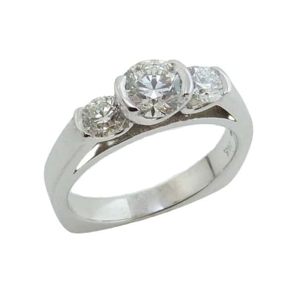 Lady's 14K white gold semi-bezel diamond ring set in the center with a 0.527 carat, I, VS1 Hearts On Fire diamond and accented on the sides with two, H-I, VS-SI, Hearts On Fire diamonds totaling 0.37 carats.