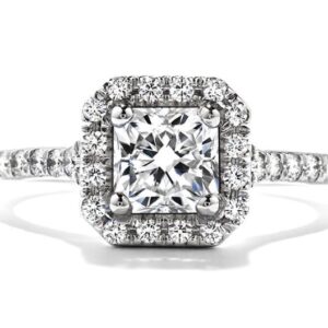 Platinum engagement ring known as Transcend Dream by Hearts On Fire set with a 0.70carat H, VS2 ideal Dream cut diamond by Hearts On Fire accented with ideal round brilliant cut diamonds by Hearts On Fire, 0.45 carat total weight, G/H, VS-SI.