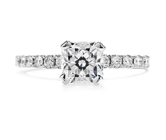 18K white gold engagement ring known as "Enrichment Solitaire" by Hearts On Fire set with a ideal Dream cut diamond by Hearts On Fire 0.82ct, I, VVS2 and accented with ideal round brilliant cut diamonds by Hearts On Fire, 0.504 carat total weight, G/H, VS-SI. This is a discontinued style.
