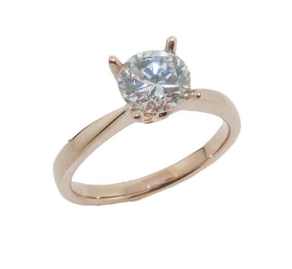Lady's 14K rose gold solitaire engagement ring set with 1 carat CZ. Priced without a center gemstone. Let us find you the perfect center that fits your tastes and budget!