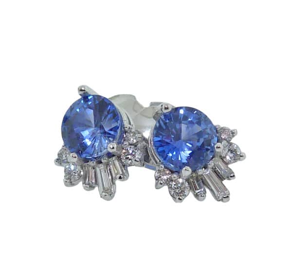 14K white gold earrings set with 2 = 1.91cttw sapphires and accented with 14 = 0.279cttw diamonds. 