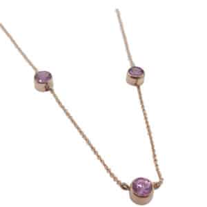 14K rose gold necklace bezel set with 3 = 1.86cttw rose sapphires.