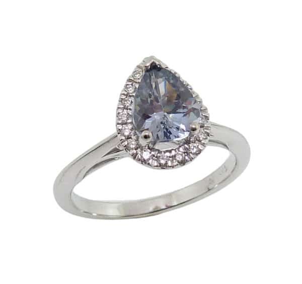 14K White gold pear shape halo on an accented shank, set in the centre with 1.08ct pear shape "silver" spinel and 0.105cttw round brilliant cut diamonds on the halo.