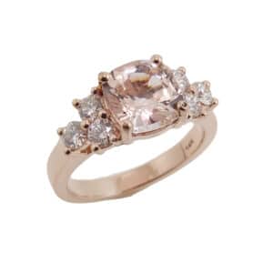 14 karat rose gold ring featuring a 2.39ct blush sapphire, 6 = 0.88cttw round brilliant cut diamonds.