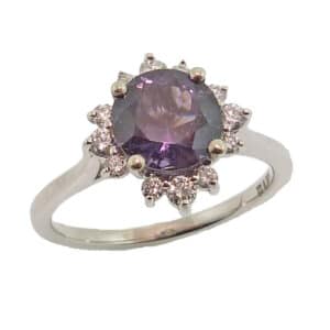 14K white gold halo style ring set with a 1.58ct Purple Spinel accented with 0.24cttw H/I, SI round brilliant cut diamonds.
