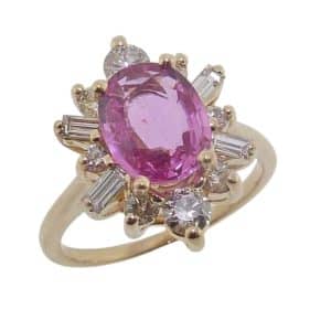 14K Yellow gold lady's coloured gemstone stylized halo lady's ring set with a 1.94ct oval pink sapphire and accented with 12 round brilliant cut diamonds, 0.78 total carat weight, G/H, SI.
