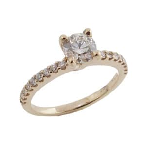 Lady's 14K yellow diamond ring, set with 0.50 carat H, SI1, excellent cut round brilliant cut diamond by CanadaMark accented with 18 G-H, SI1 very good/excellent cut round brilliant cut diamonds totaling 0.18 carats.