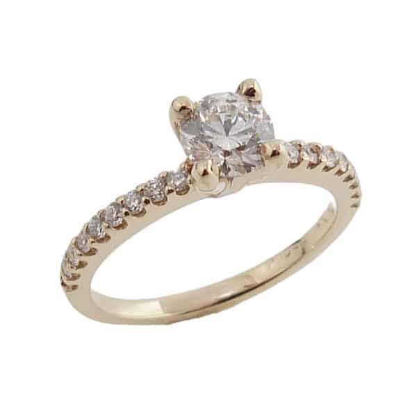 Lady's 14K yellow diamond ring, set with 0.50 carat H, SI1, excellent cut round brilliant cut diamond by CanadaMark accented with 18 G-H, SI1 very good/excellent cut round brilliant cut diamonds totaling 0.18 carats.