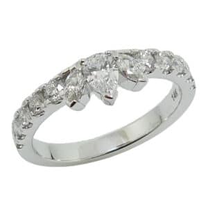 Lady's 14K white gold diamond band, set with one 0.18 carat pear shape diamond, two marquise diamonds totaling 0.11 carats and ten round brilliant cut diamonds totaling 0.35 carats, F-G SI1-VS2, excellent cut.