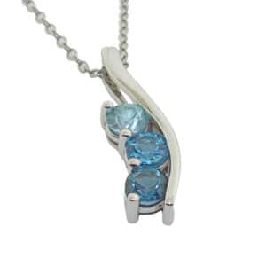 14kw pendant set with a blue zircon, Swiss topaz, London topaz
