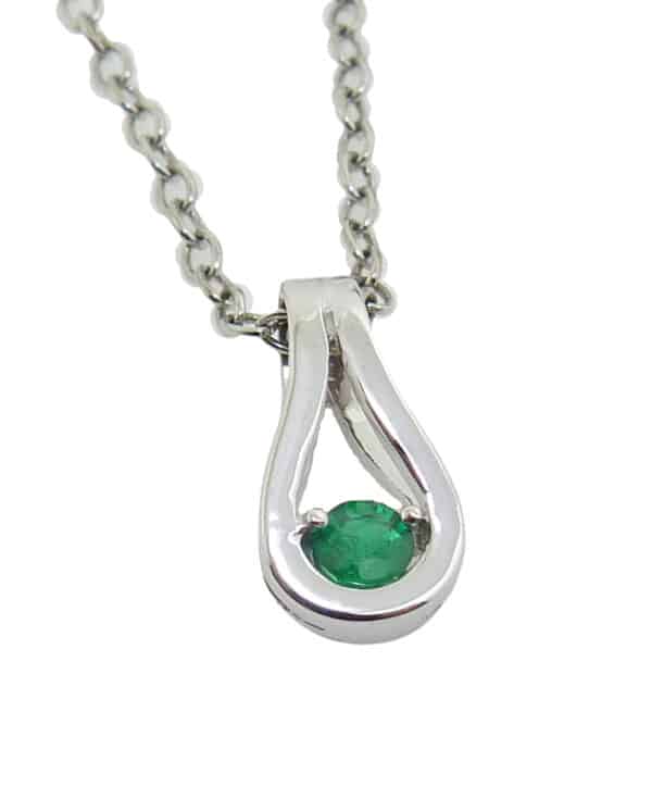 14K white gold pendant set with a 0.08ct emerald.