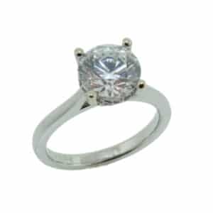 19K White gold solitaire engagement ring for a 1.5ct centre with a hidden halo set with 12 round brilliant cut diamonds, 0.10cttw, F/G, SI-VS.