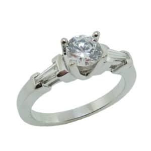 14K White gold three stone engagement ring set in the centre with a 0.50ct CZ and accented on each side with 2 tapered baguette diamonds, 0.20cttw, G/H, VS.  Priced without a center gemstone. Let us find you the perfect center that fits your tastes and budget!