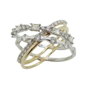 14K White and yellow gold lady's right hand crisscross ring claw set with 0.391cttw, G/H, SI baguettes and 0.785cttw, G/H, SI round brilliant cut diamonds.