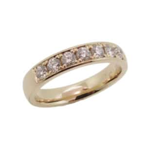 14K Yellow gold lady's pave set band set with 7 round brilliant cut diamonds, 0.70cttw, G/H, VS-SI.