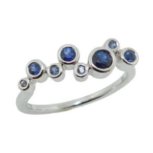 14K white gold ring set 0.398cttw of graduated sapphires.