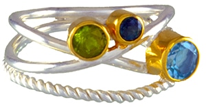 Michou collection silver and 22K gold vermeil lady's band set with a peridot, envy topaz, and sky blue topaz. 