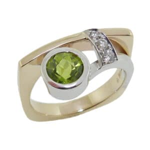 14K Yellow and white gold lady's ring set with 1.17ct peridot and 3 round brilliant cut diamonds, 0.093cttw, G/H, SI1-2. This unique ring is a custom design by David as a part of his Studio Tzela line.