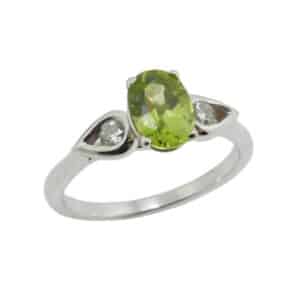 14KW coloured gemstone lady's ring set with: - 7x5 Peridot - 2 round brilliant cut diamonds, 0.118cttw, SI