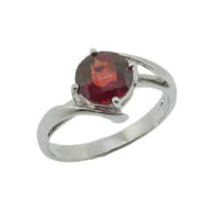 14K white gold lady's bypass ring claw set with a round 1.50ct checkerboard cut red garnet.