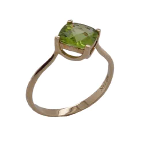 14K Yellow gold lady's ring offset with a 1.8ct checkerboard cut peridot.