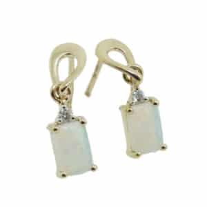 14 karat yellow gold dangle earrings claw set with two rectangular opals totaling 1 carat and accented with two diamonds totaling 0.03 carats G/H, VS-SI.