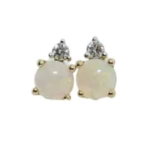 14 karat yellow gold stud earrings set with two round opals totaling 0.40 carats and two round brilliant cut diamonds totaling 0.04 carats, G/H, VS-SI.