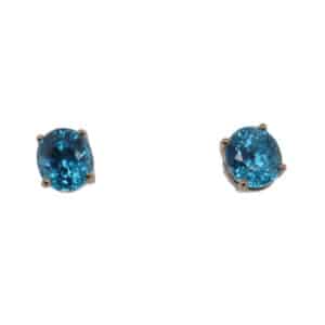 14 karat yellow gold studs set with two oval blue zircons totalling 5.04 carats.