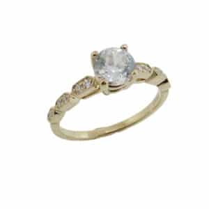 14K Yellow gold engagement ring by Ancora Designs set in the centre with a 0.75 carat CZ centre and with 12 pave round brilliant cut diamonds, 0.10 total carat weight, G/H, VS-SI.