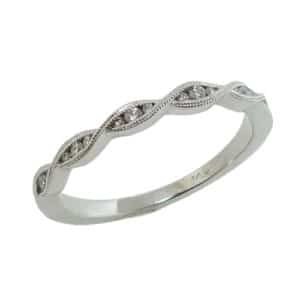 14K white gold diamond twist band with milgrain detail pave set with fifteen round brilliant cut diamonds, totaling 0.08 carats.