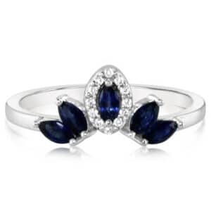 14K White gold lady's fashion ring set with five blue marquise sapphires, 0.6 total carat weight, and in the halo with twelve round brilliant cut diamonds, 0.06 total carat weight, H/I, SI2.