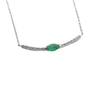 14K White gold 18" cable chain with 16" adjustment bar necklace set with a 0.13 carat marquis emerald and 12 round brilliant cut diamonds, 0.06 total carat weight.