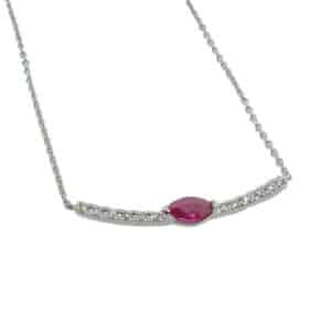 14K White gold curved bar necklace on 18" inch with 16" loop cable chain claw set on the bar with a 0.16 carat marquise ruby and 12 round brilliant cut diamonds, 0.07 total carat weight.