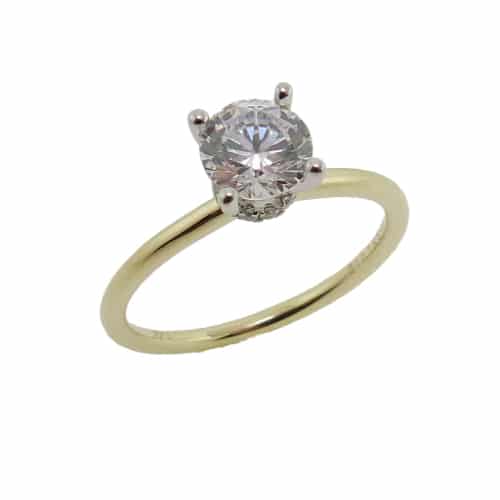 14K Yellow and white gold Sylvie Collection hidden halo engagement ring set with a 0.75 carat CZ and claw set diamonds, 0.07cttw, G/H, VS-SI, in the hidden halo. Available in 14K gold, 18K gold, or platinum. This ring can be made in any combination of white, pink or yellow gold and can be customized to accommodate different size and shape diamonds, by special order. Priced without a center gemstone. Let us find you the perfect center that fits your tastes and budget!