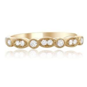 14K Yellow gold ladies diamond band with milgrain detail pave set with 10 round brilliant cut diamonds totaling 0.17 carats.