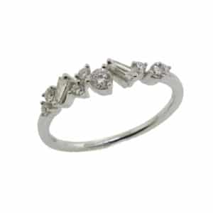 14K White gold staggered lady's diamond band set with 0.28 total carat weight round and baguette diamonds.