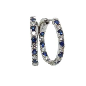 14K White gold hoops set with 16 round brilliant cut diamonds, 0.25 total carat weight, alternating with 18 blue sapphires, 0.39 total carat weight. 