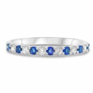 14K White gold lady's band claw set with 8 round brilliant cut diamonds, 0.15 total carat weight, and 7 blue sapphires, 0.24 total carat weight.