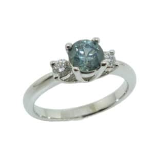14K White gold lady's coloured gemstone ring set with 0.79 carat Montana sapphire and 2 round brilliant cut diamonds, 0.18 total carat weight.