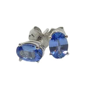 14K  white gold stud earrings set with two blue oval sapphires totaling 0.93 carats.