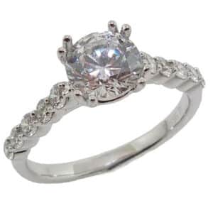 14K White gold engagement ring double claw set in the centre with a 1 carat CZ and on the band with 10 round brilliant cut diamonds, 0.38 total carat weight.