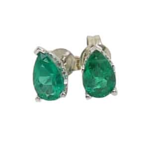 14 karat white gold emerald stud earrings set with two pear shaped emeralds totaling 0.97 carats.