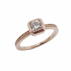 14K rose gold engagement ring set with 0.492 carat I, SI1 Dream diamond by Hearts on Fire.