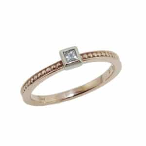 14K rose and white gold engagement ring bezel set with 0.05carat G-H, SI1 princess cut diamond.