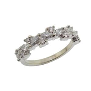 14K White gold lady's scattered diamond band claw set with 8 round brilliant cut diamonds, excellent cut, F/G, SI1, 0.255 total carat weight and 7 marquise diamonds, F/G, VS-SI, 0.40 total carat weight.