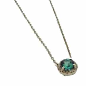 Lady's 14K white gold necklace set with 0.94 carat Paraiba Tourmaline Mozambique and accented with eighteen round brilliant cut diamonds totaling 0.07 carats